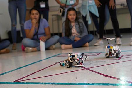 A robot on wheels on the ground